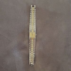 Ladies Silvertone/goldtone watch with crystal at the 12 o'clock position